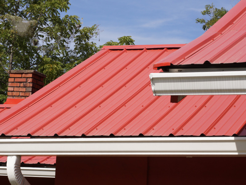 red metal roof installed at residential property close up corryton tn